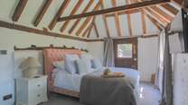 Bedroom 1 is on the ground floor and has access to the cottage garden.
