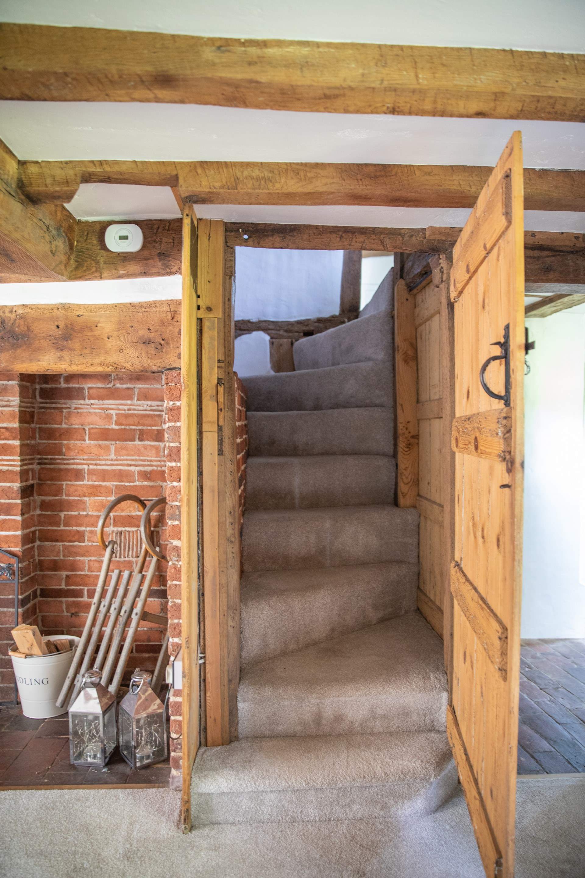 Stairs lead to the first floor where there are two bedrooms and an en suite bathroom.