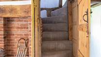 Stairs lead to the first floor where there are two bedrooms and an en suite bathroom.