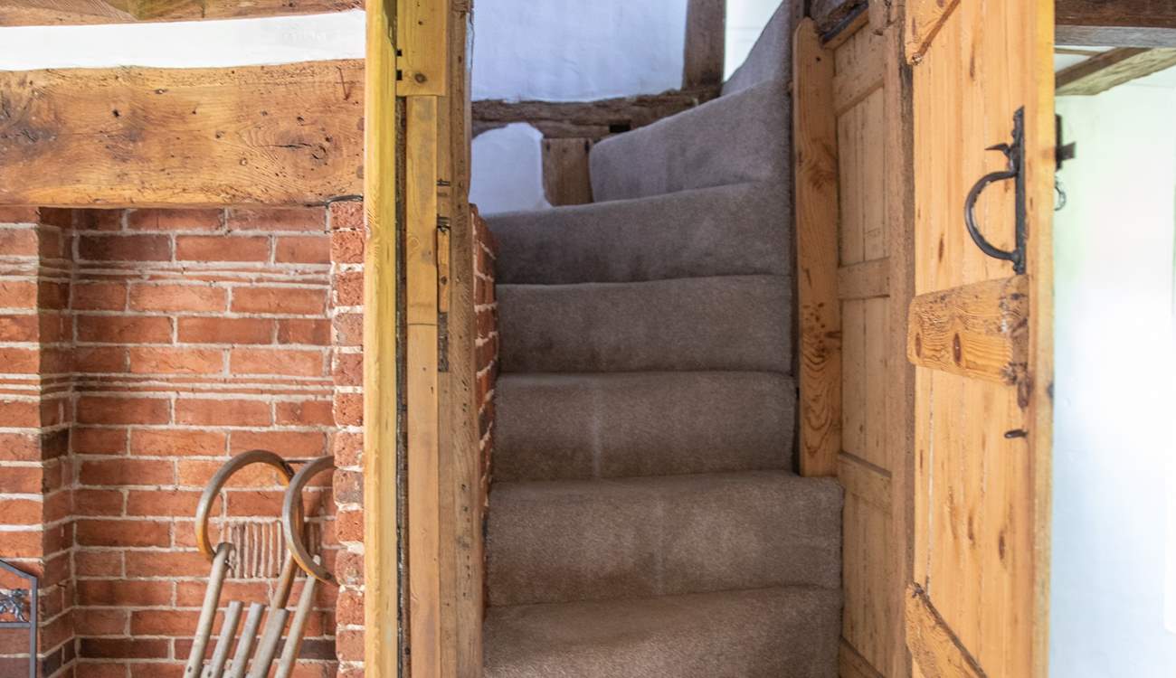 Stairs lead to the first floor where there are two bedrooms and an en suite bathroom.