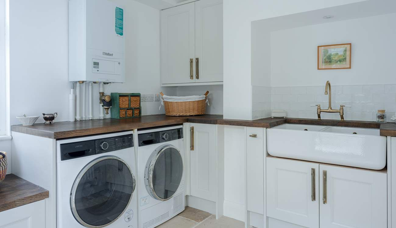 Completing the kitchen is a large separate utility-room with washer, dryer and lots of space for drying/airing. The rear patio also has a pull out line.