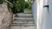 Steps up from the rear access to the garage.