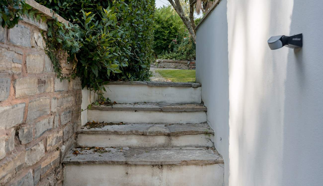Steps up from the rear access to the garage.