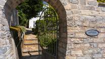 Pedestrian access is via the wrought iron gate and then a gentle climb up the steps to the house.