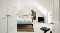 The primary suite (bedroom 4) sits on its own floor at the top of the house and has commanding sea views from the Juliet balcony. 