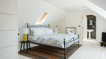 This wonderfully calm and pared back suite has a four-poster super-king bed and plenty of storage.