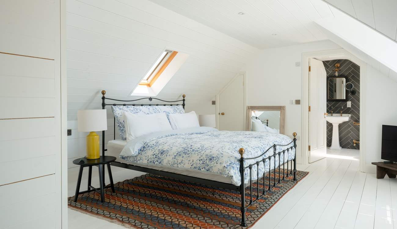 This wonderfully calm and pared back suite has a four-poster super-king bed and plenty of storage.