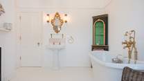 The family bathroom is wonderfully grand and packed with style and original features.