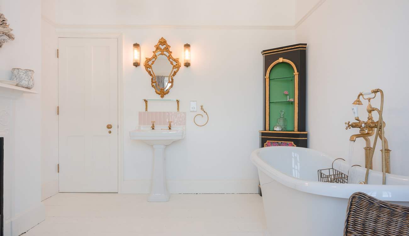 The family bathroom is wonderfully grand and packed with style and original features.