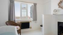 Imagine taking a soak in the deep roll-top bath with sea and rooftop views...