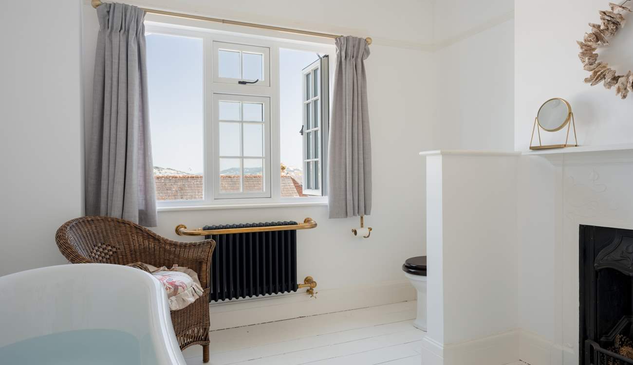 Imagine taking a soak in the deep roll-top bath with sea and rooftop views...