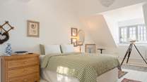 The sumptuous king bed just beckons you in and the dual-aspect gives this room a wonderfully open and bright feel.