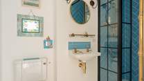 This luxury en suite is beautifully styled and features a large shower enclosure.