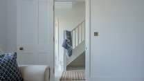 The main staircase is off the central hallway and will lead you up two floors to the four fabulous bedrooms.