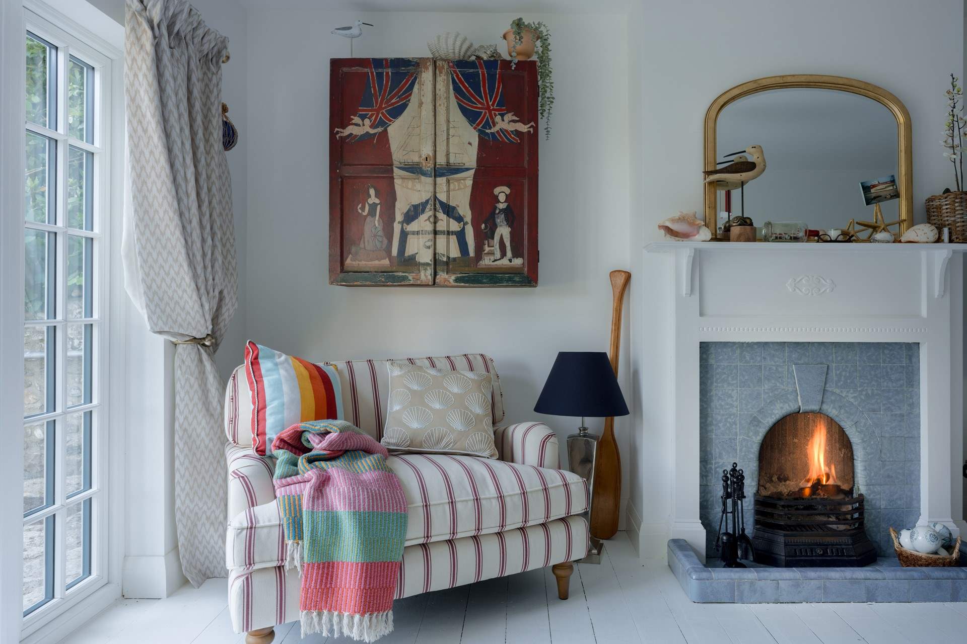 Imagine curling up here with a good book and gazing out over the gardens...