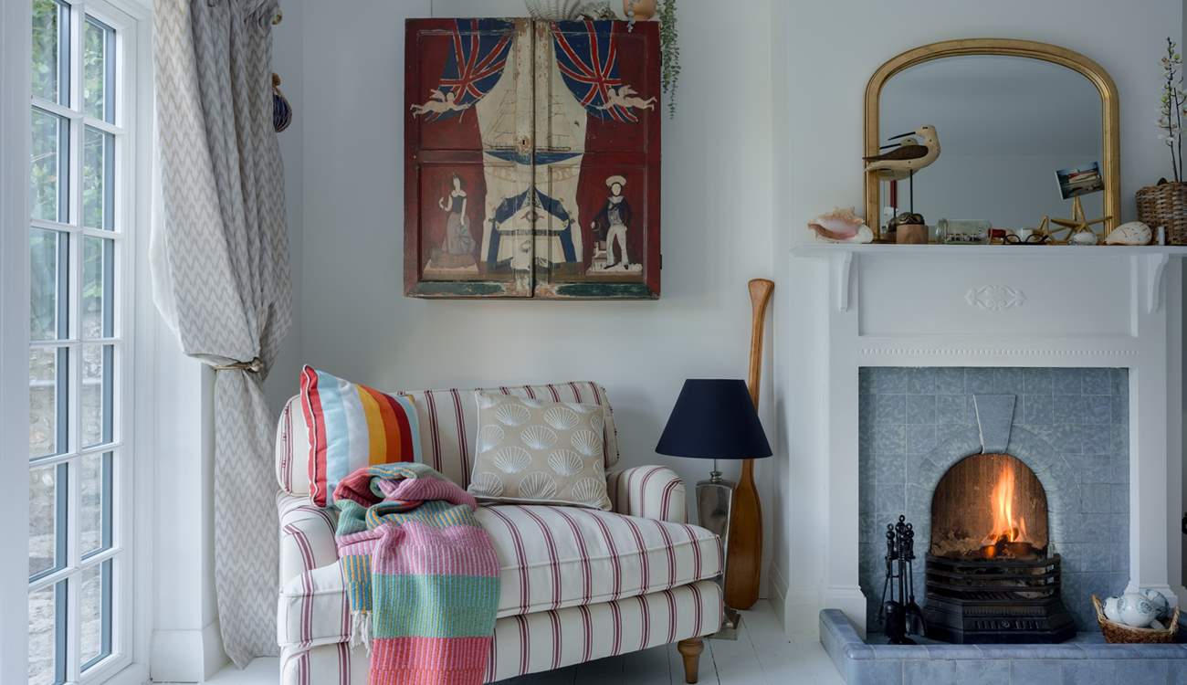 Imagine curling up here with a good book and gazing out over the gardens...