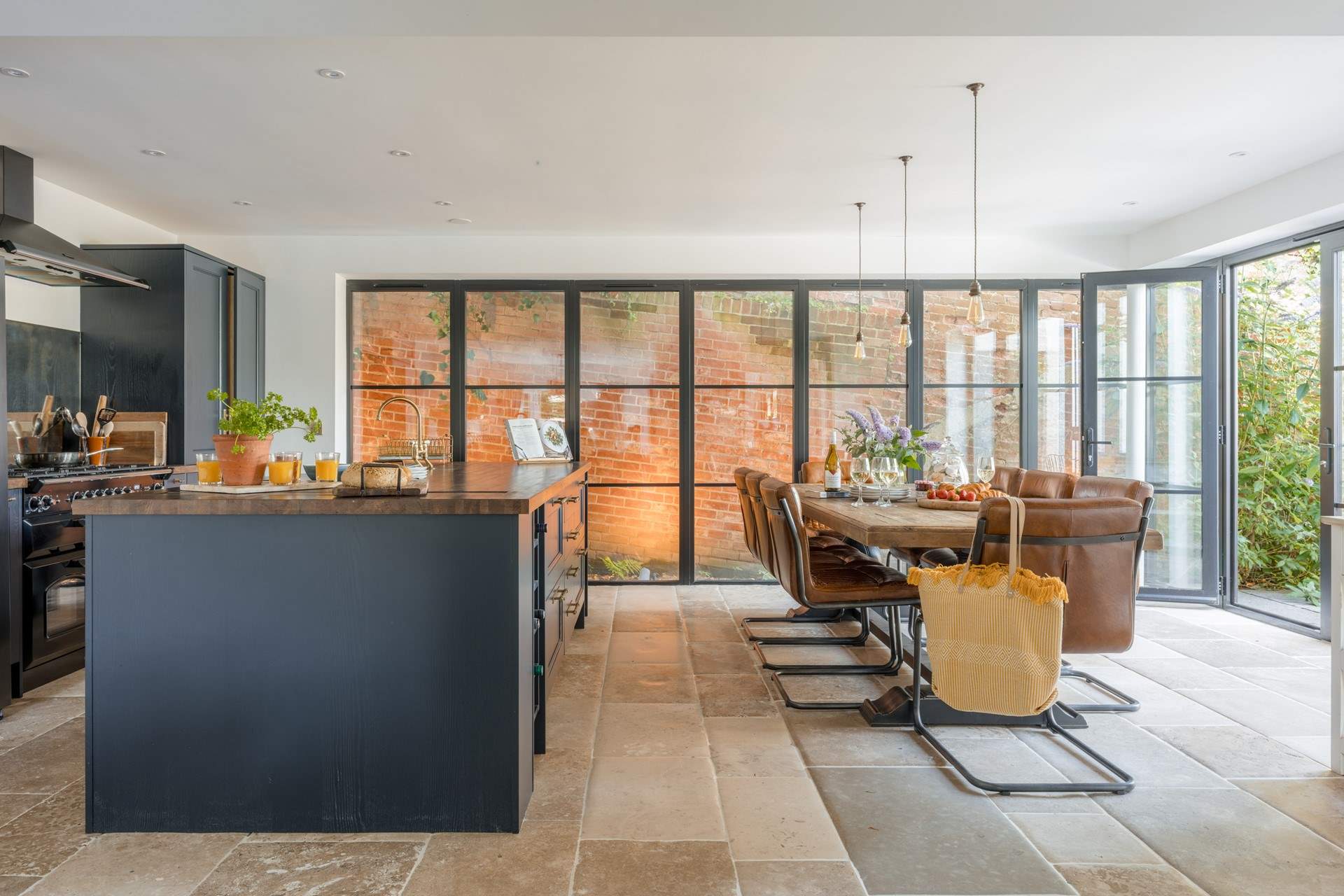 The walls of glass are a striking feature and the giant dining-table will make a wonderful spot for some indulgent feasting.