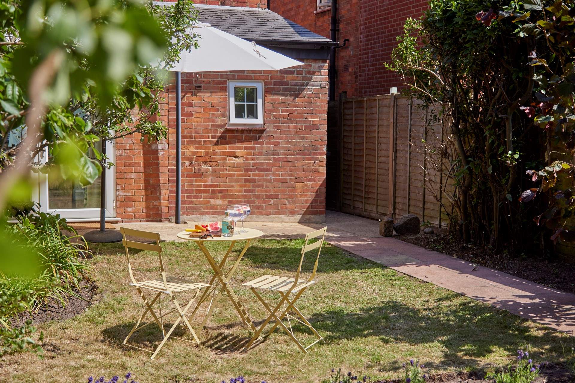 Surrounded by fruit trees this green oasis is the perfect spot for some al fresco refreshments.