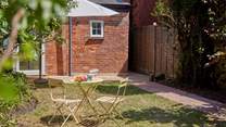 Surrounded by fruit trees this green oasis is the perfect spot for some al fresco refreshments.