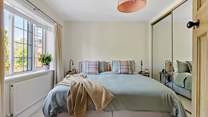 The primary bedroom is peaceful perfection. Super soft linen and a sumptuous super-king size bed (can be split into two singles on request). No doubt you will sleep well here...