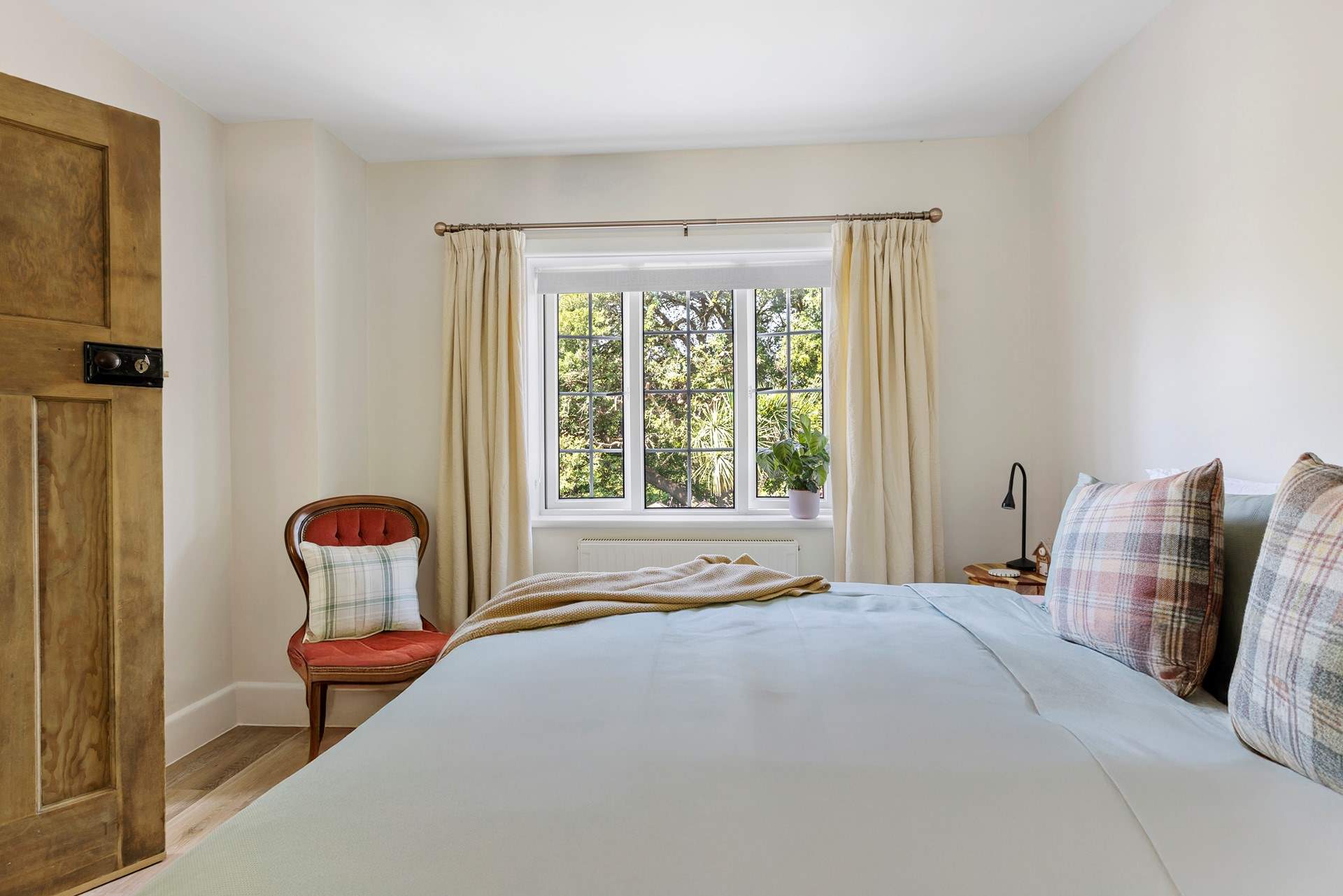 Views out over the garden from the primary bedroom and the sounds of birdsong drifting in...