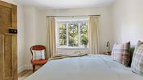 Views out over the garden from the primary bedroom and the sounds of birdsong drifting in...