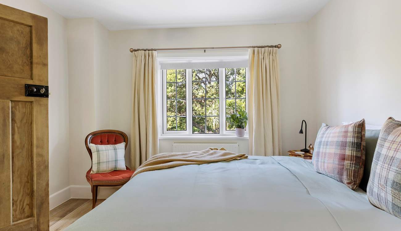 Views out over the garden from the primary bedroom and the sounds of birdsong drifting in...