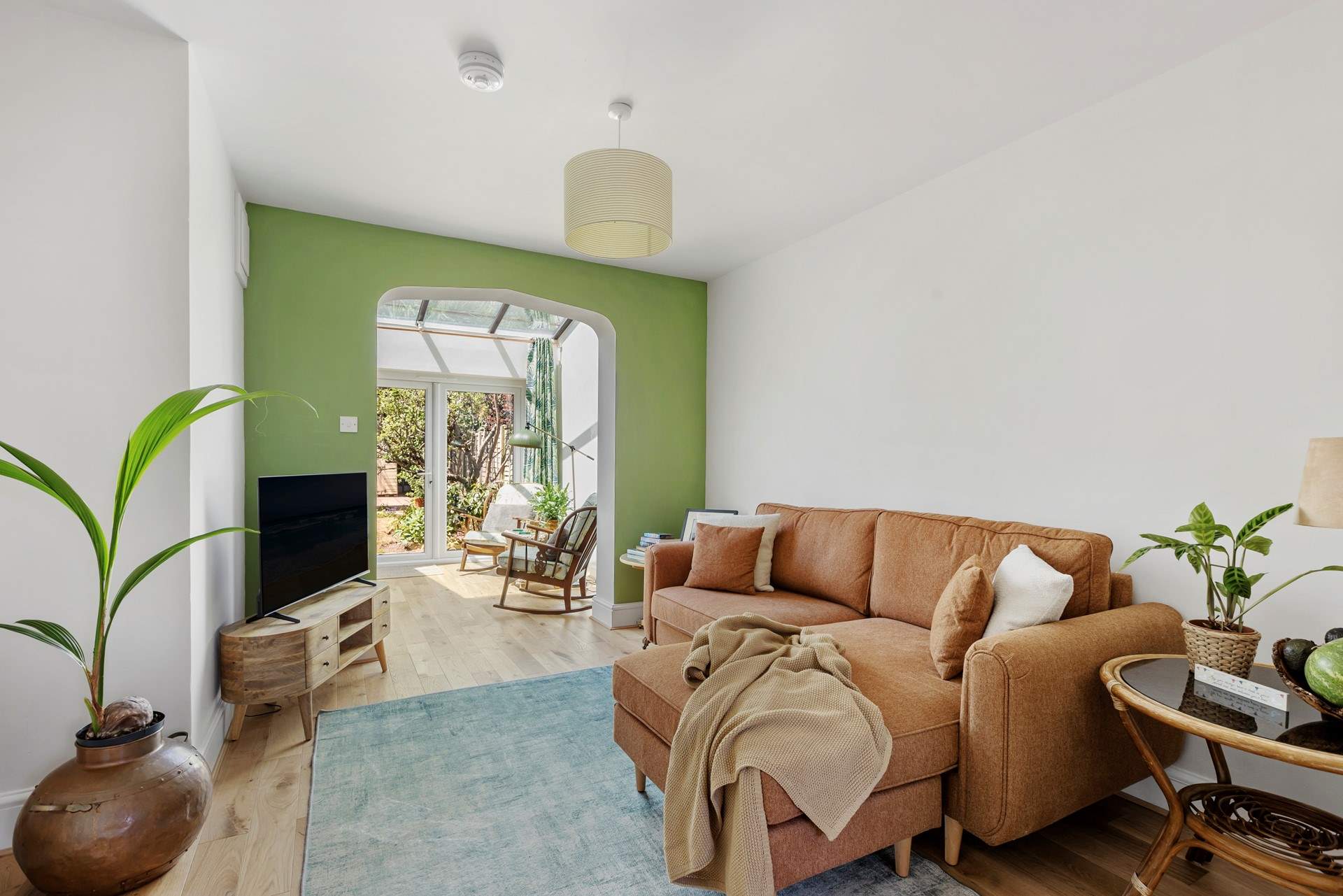 Light floods the open plan living space.