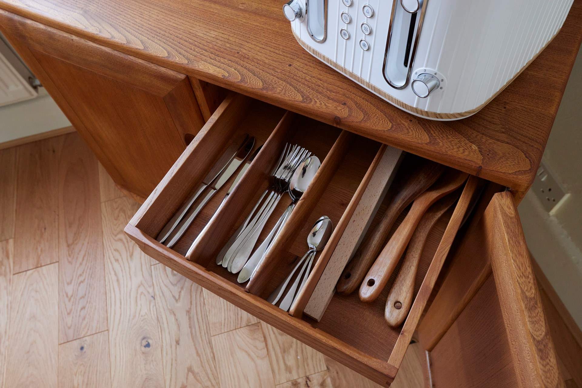 The cabinet in the dining-area is where you will find plates and glassware.
