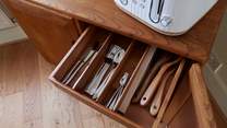 The cabinet in the dining-area is where you will find plates and glassware.