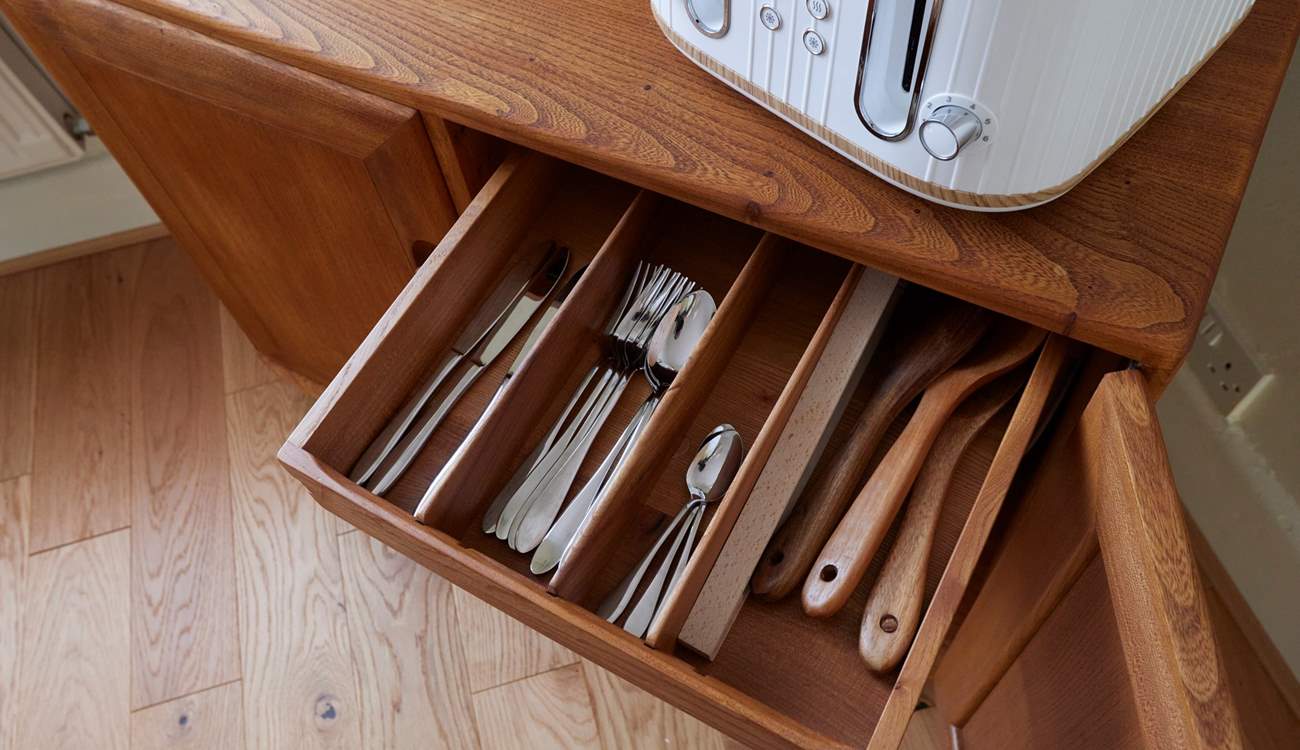 The cabinet in the dining-area is where you will find plates and glassware.