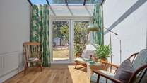 The sun-room is a real triumph - what a spot to gaze over the garden and soak in the rays.