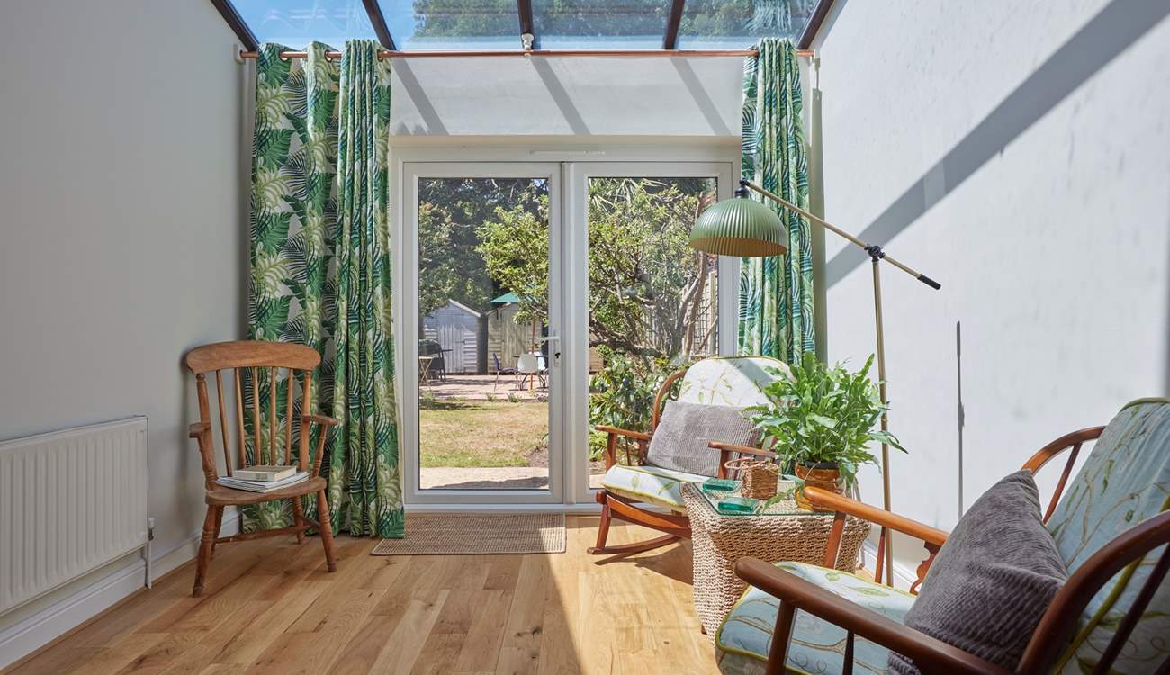 The sun-room is a real triumph - what a spot to gaze over the garden and soak in the rays.
