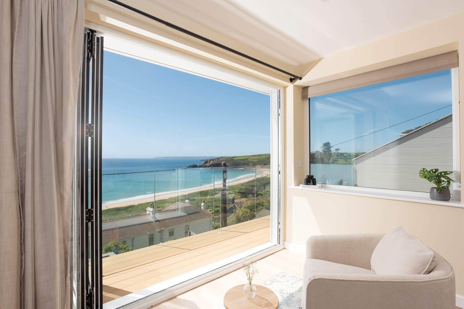 A balcony where the sea and sky create an ever changing coastal backdrop.
