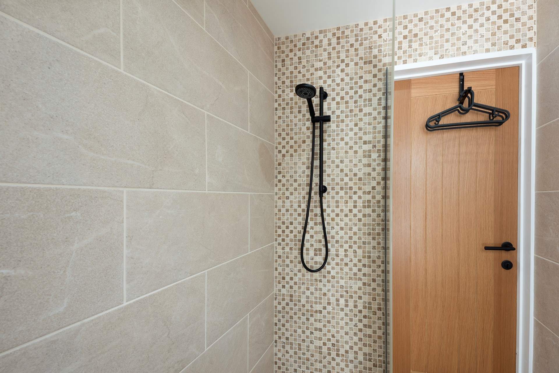 There is a handy wet-room with a shower as you enter the back door to wash away the sea salt and hang up your beach gear.