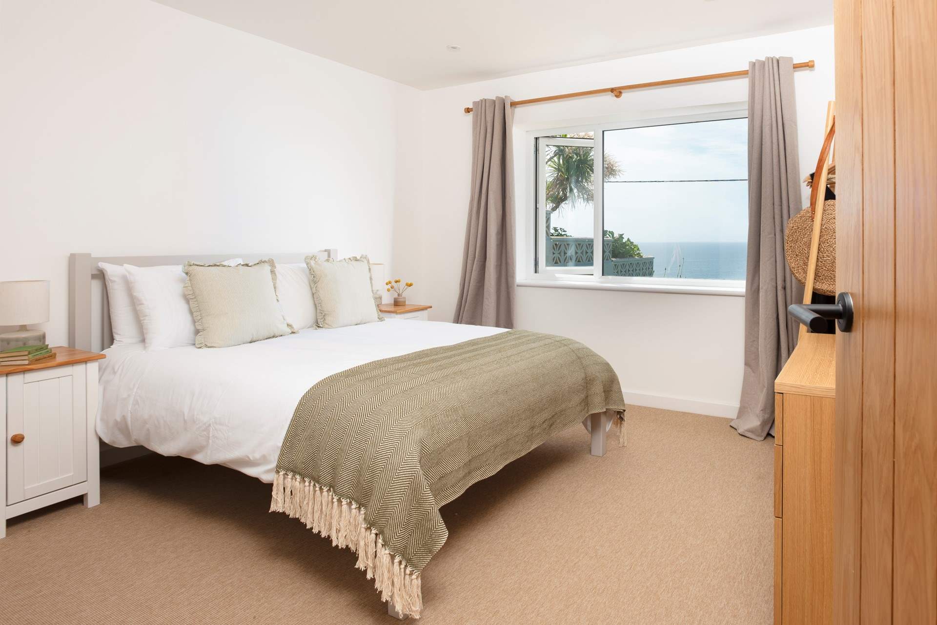 Bedroom 1 is a beautifully presented double, enjoying both sea and garden views.  A peaceful retreat with the benefit of an en suite cloakroom.
