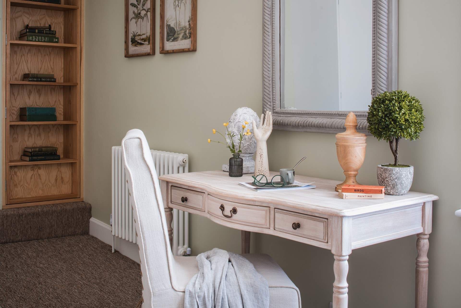 This elegant writing desk offers a place to work or write a postcard perhaps.