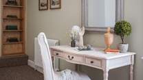 This elegant writing desk offers a place to work or write a postcard perhaps.