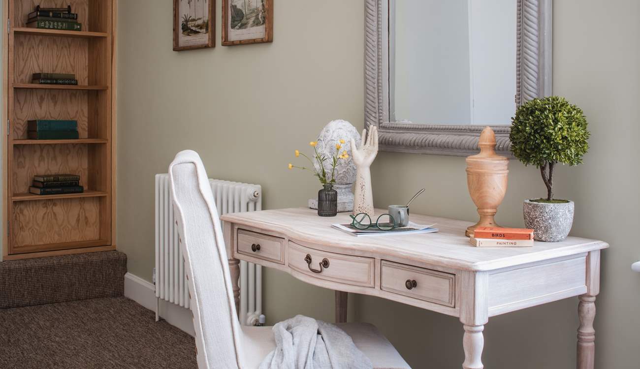 This elegant writing desk offers a place to work or write a postcard perhaps.