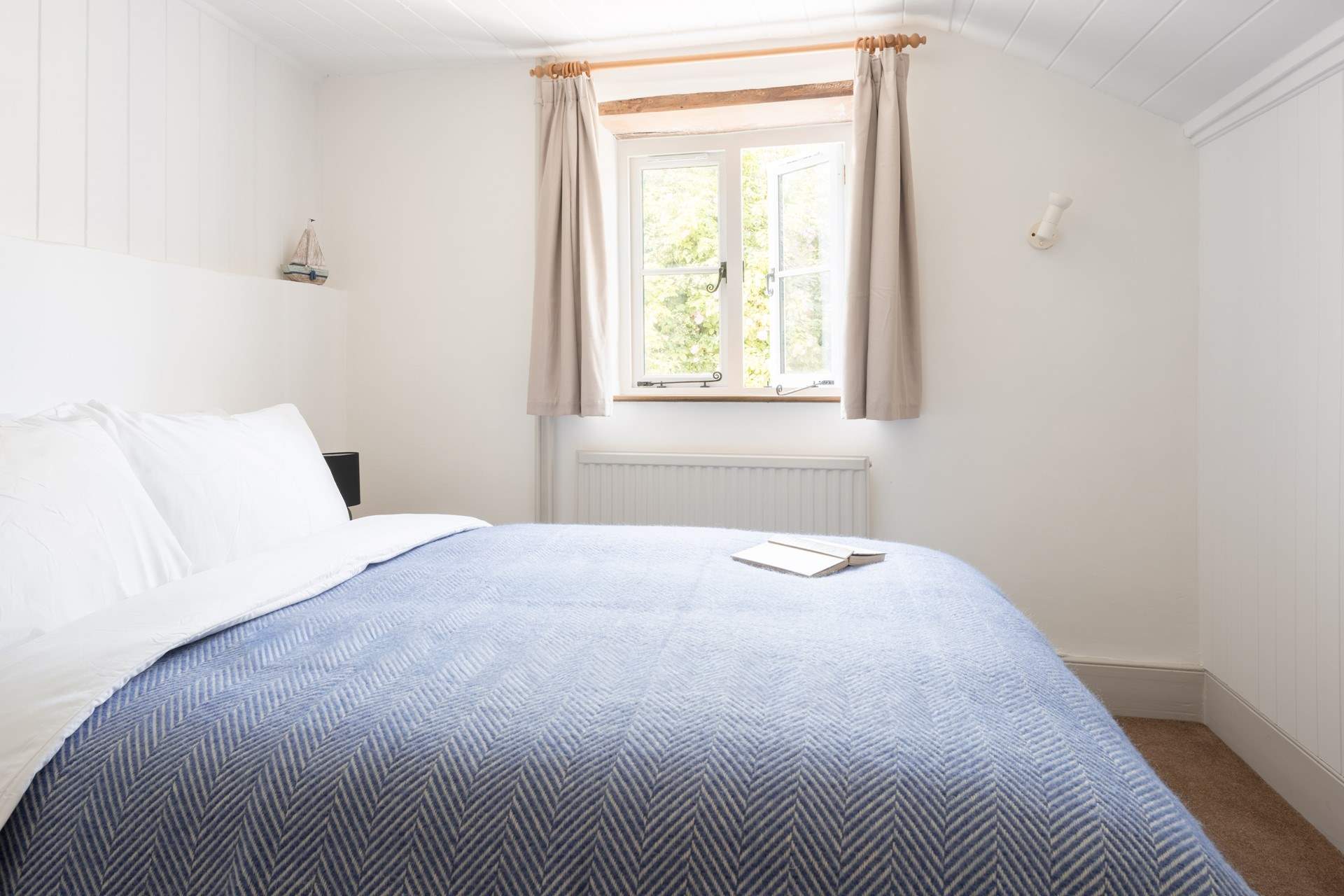 This calming room looks out over the charming cottage garden.