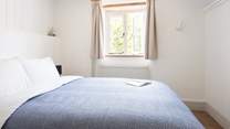 This calming room looks out over the charming cottage garden.