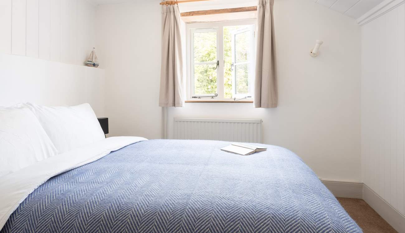 This calming room looks out over the charming cottage garden.