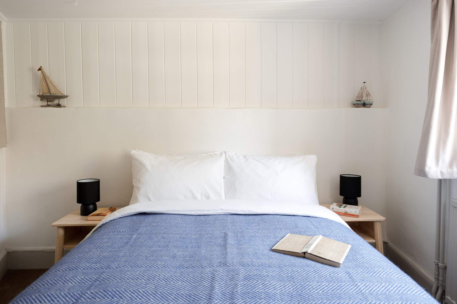 Bedroom two is a skilful example of careful styling that creates a quite blissful space to rest your head.