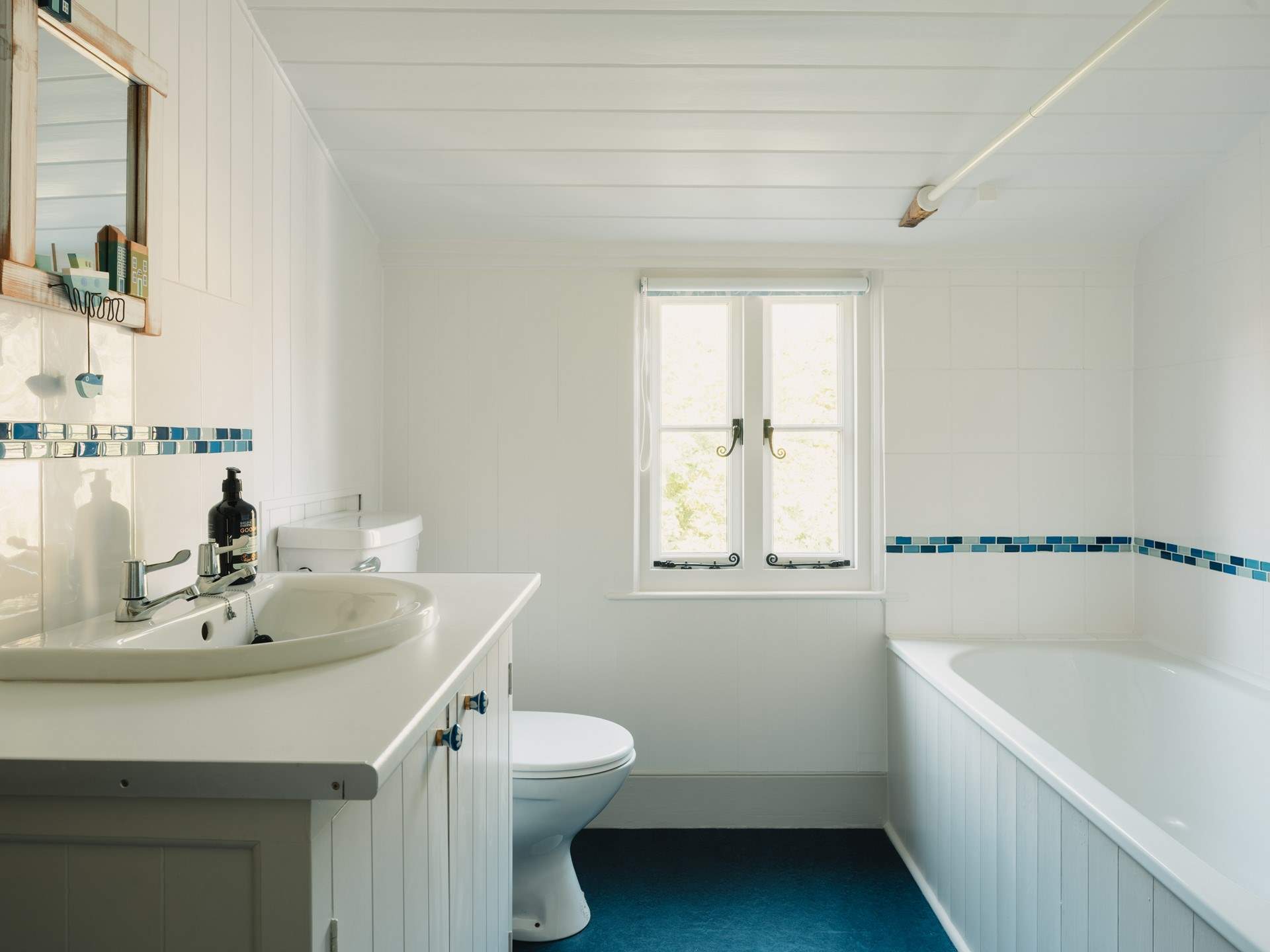 The family bathroom is bright and spacious.