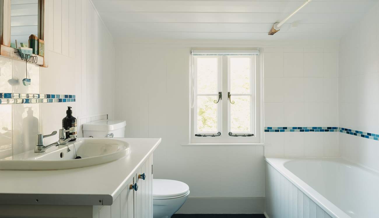 The family bathroom is bright and spacious.