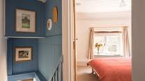 Venturing upstairs you will find the coastal styling continues as you discover the bedrooms...