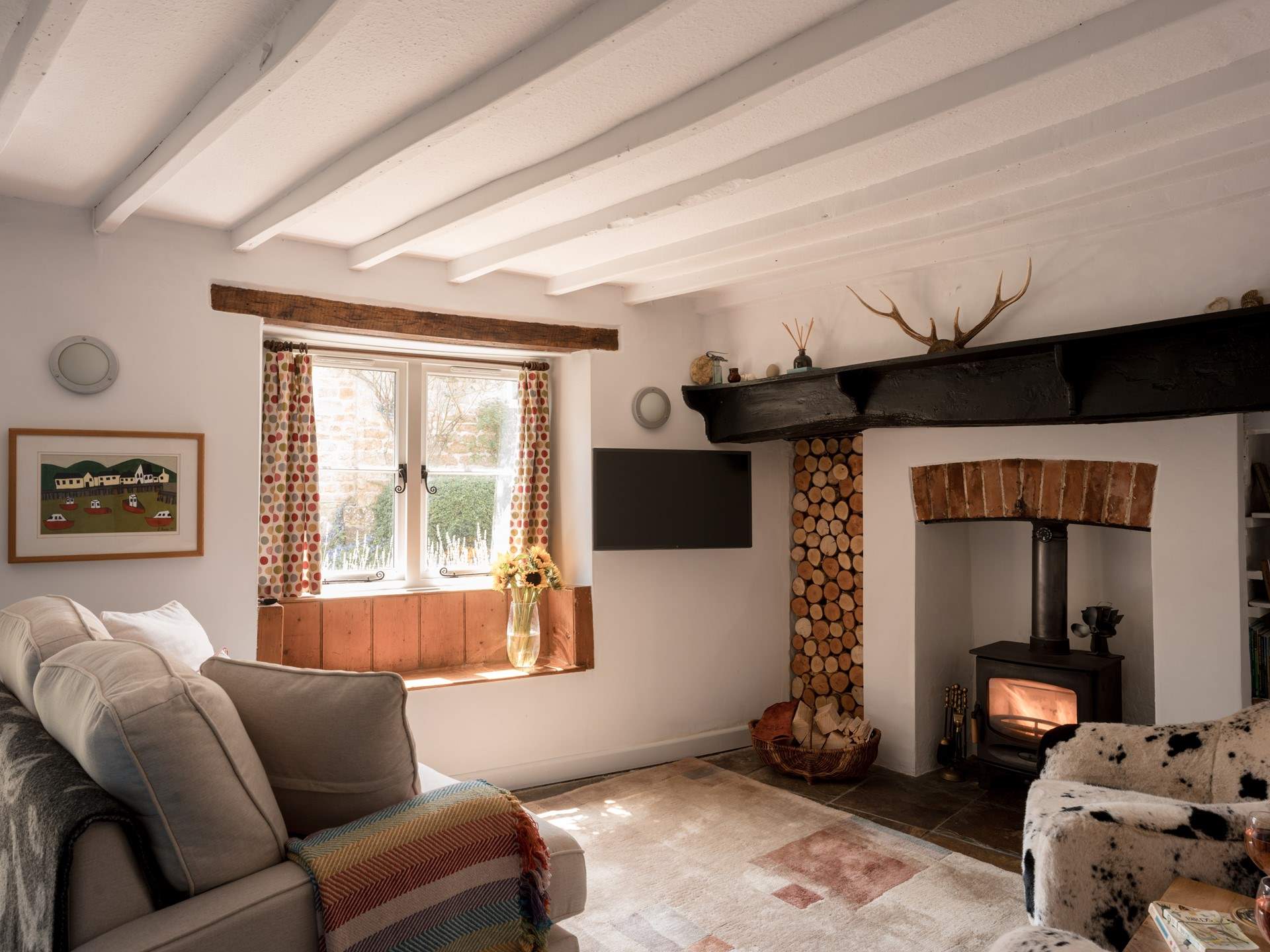 The natural light pours in throughout the day but the wood-burner is perfect for cosying up around in the colder months.