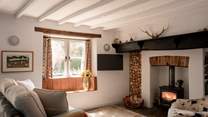 The natural light pours in throughout the day but the wood-burner is perfect for cosying up around in the colder months.
