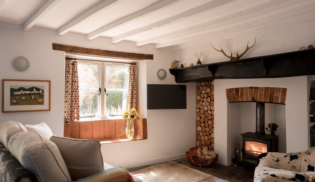 The natural light pours in throughout the day but the wood-burner is perfect for cosying up around in the colder months.