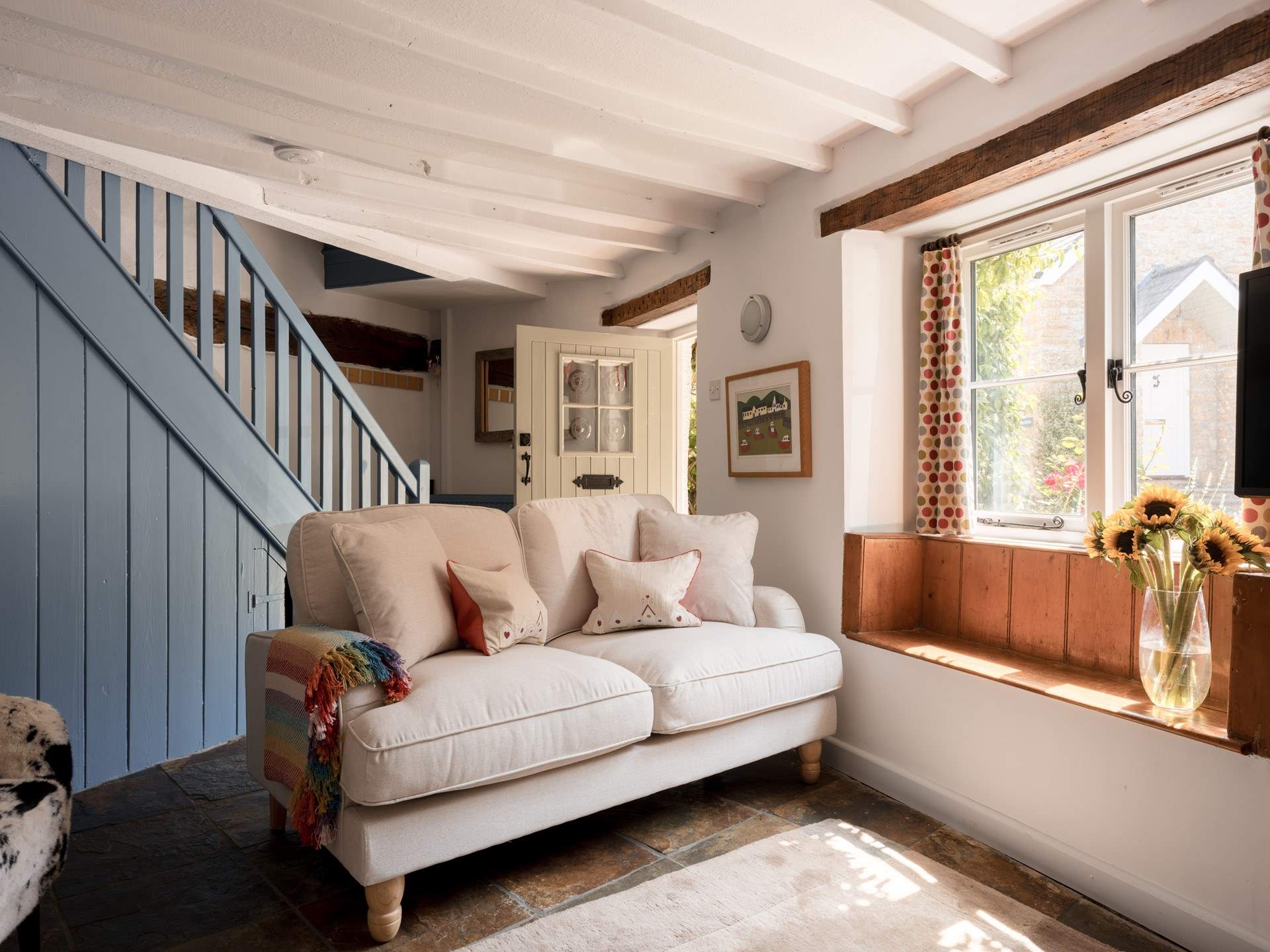 The sitting-room is just right for four guests and packed with original features and charm. Imagine a morning coffee with a book sat in the window seat...